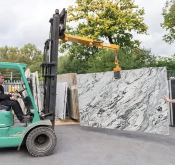 Crates of Turkish marble and travertine tiles and slabs being received and inspected on site